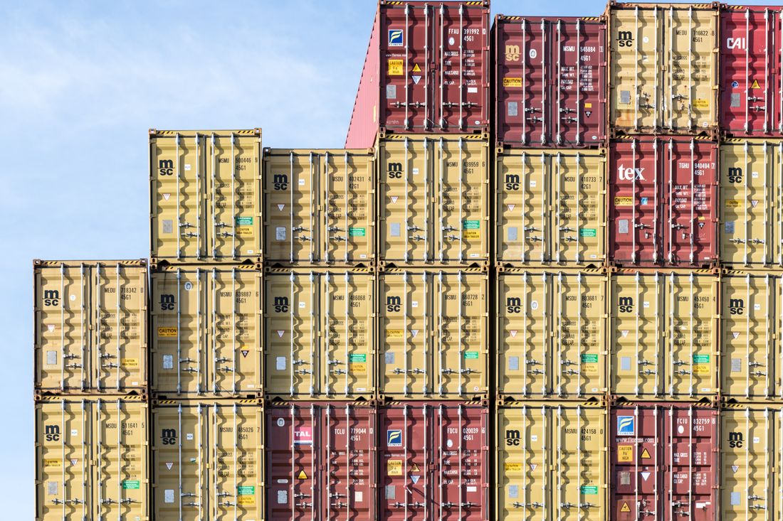 Stacked shipping containers awaiting import clearance