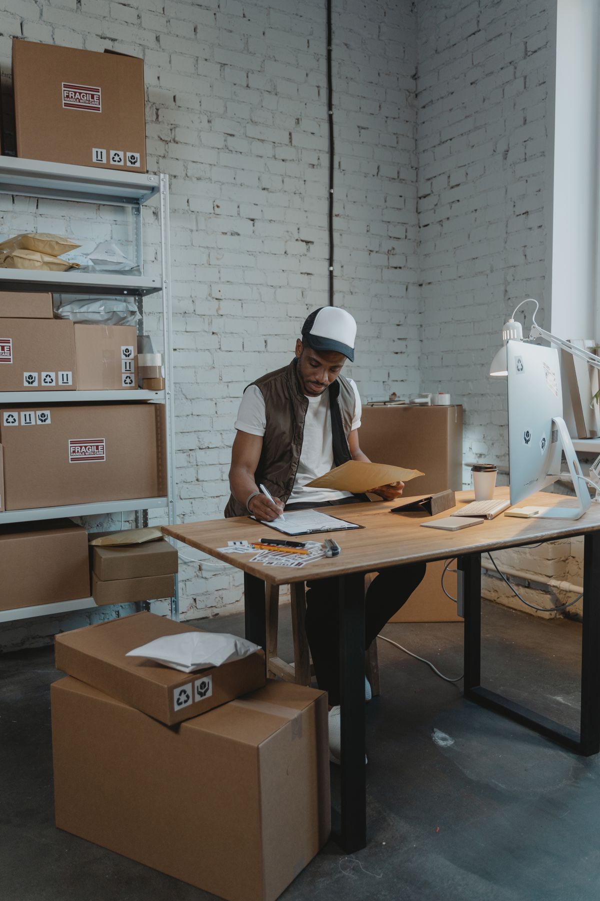 Worker preparing a small trial shipment for dispatch